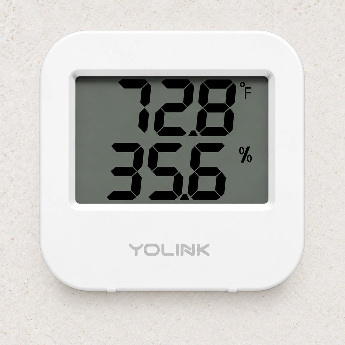 YoLink Temperature & Humidity Sensor — arranged product-only photograph on a subtle white textured surface