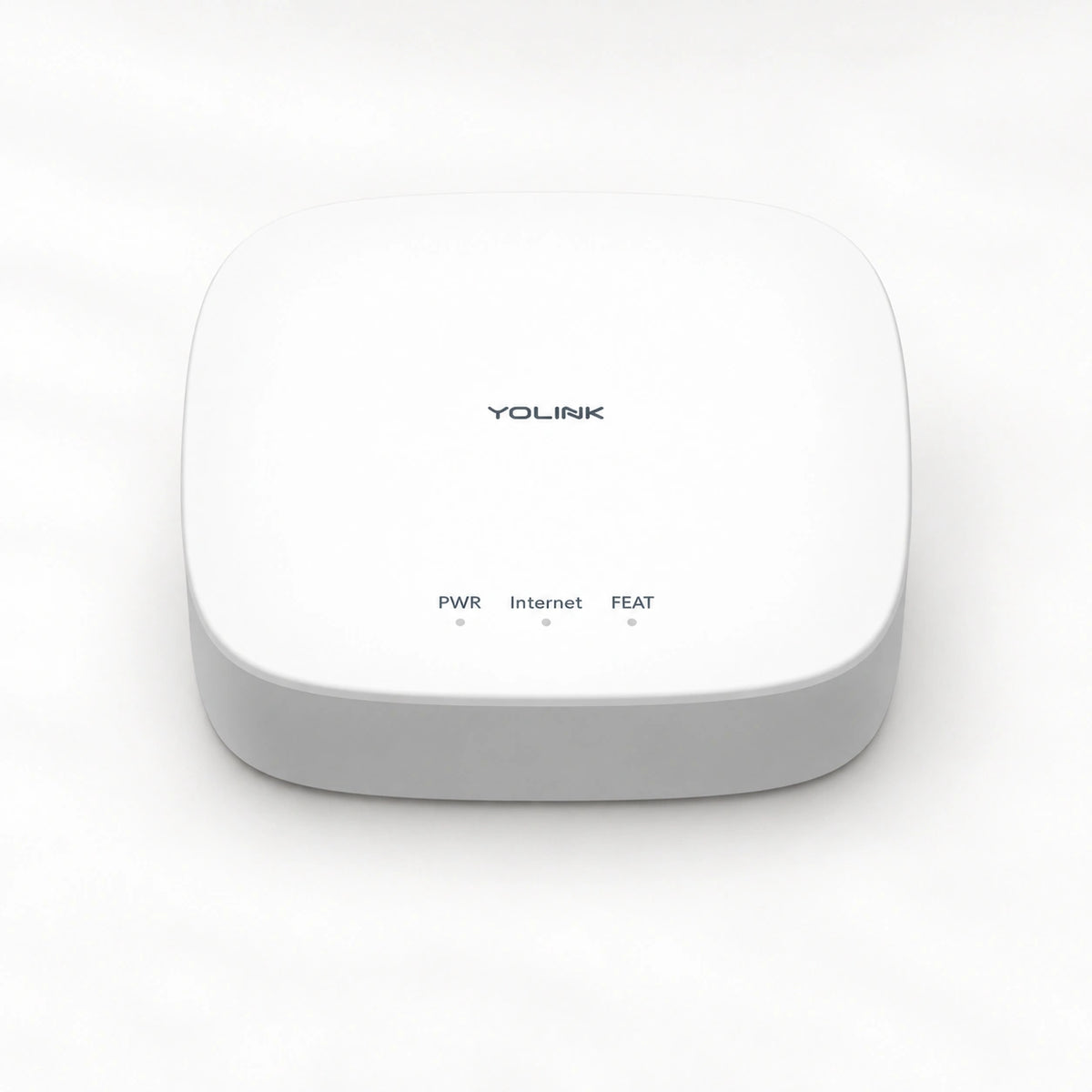 YoLink Hub — product-only photograph on smooth neutral off-white with soft diffused daylight shadows