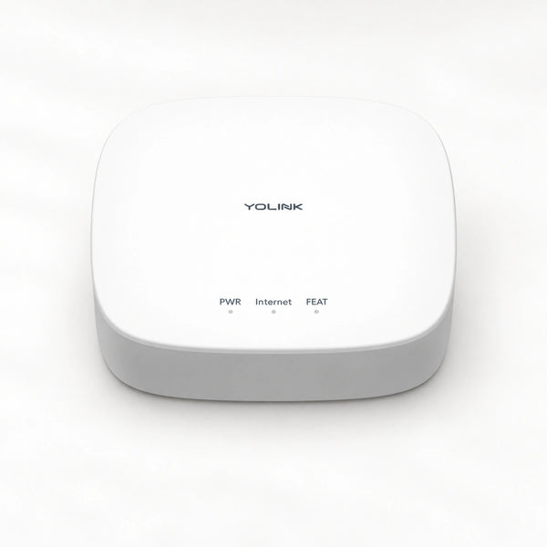 YoLink Hub — product-only photograph on smooth neutral off-white with soft diffused daylight shadows