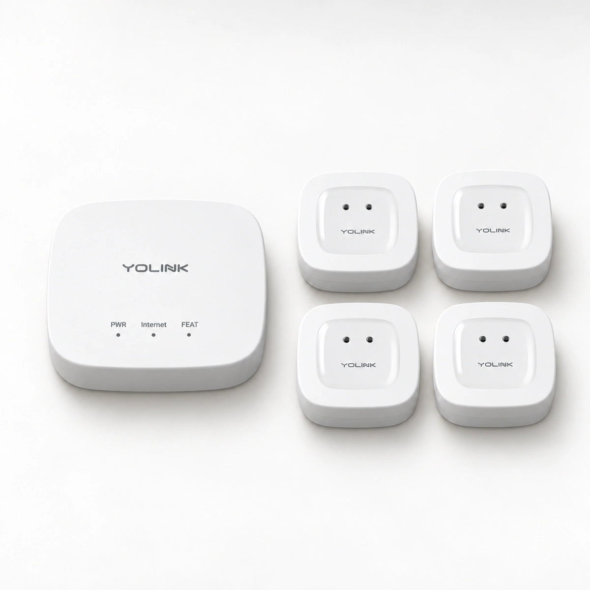 YoLink Water Leak Sensor 1 Starter Kit — product-only photograph on smooth neutral off-white with soft diffused daylight shadows