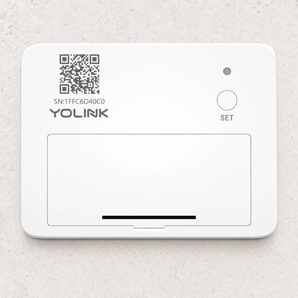 YoLink Garage Door Sensor — arranged product-only photograph on a subtle white textured surface