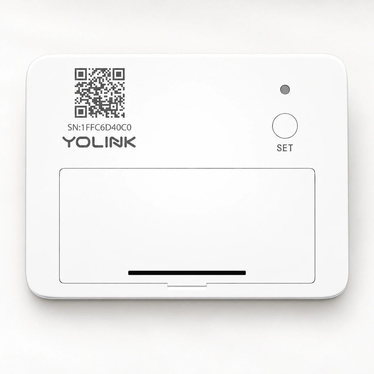 YoLink Garage Door Sensor — product-only photograph on smooth neutral off-white with soft diffused daylight shadows
