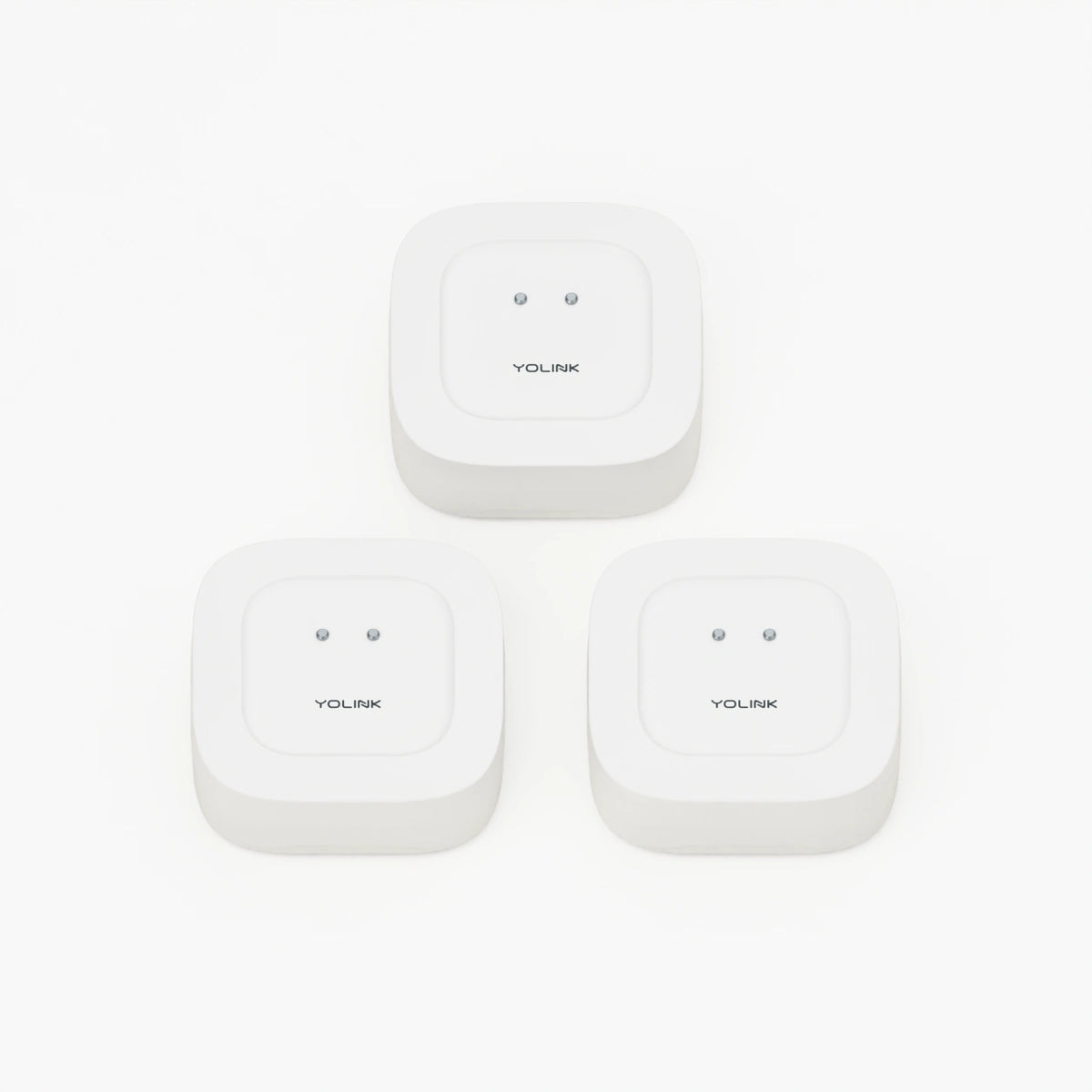 YoLink Water Leak Sensor 1, 3-Pack — product-only photograph on smooth neutral off-white with soft diffused daylight shadows