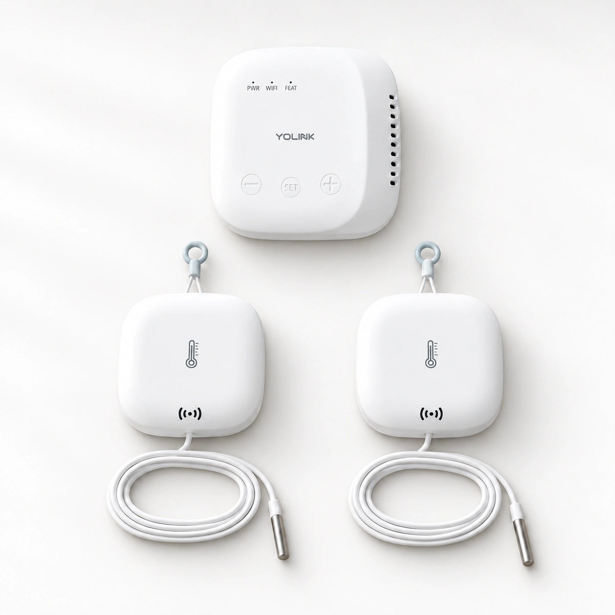 YoLink Weatherproof Temperature Sensor Starter Kit — SpeakerHub + 2 Sensors with Probe — product-only photograph on smooth neutral off-white with soft diffused daylight shadows