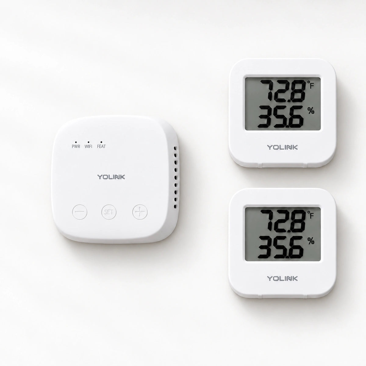 YoLink Temperature & Humidity Sensor Starter Kit — product-only photograph on smooth neutral off-white with soft diffused daylight shadows
