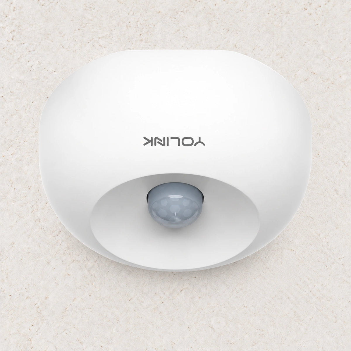 YoLink Indoor Motion Sensor — arranged product-only photograph on a subtle white textured surface