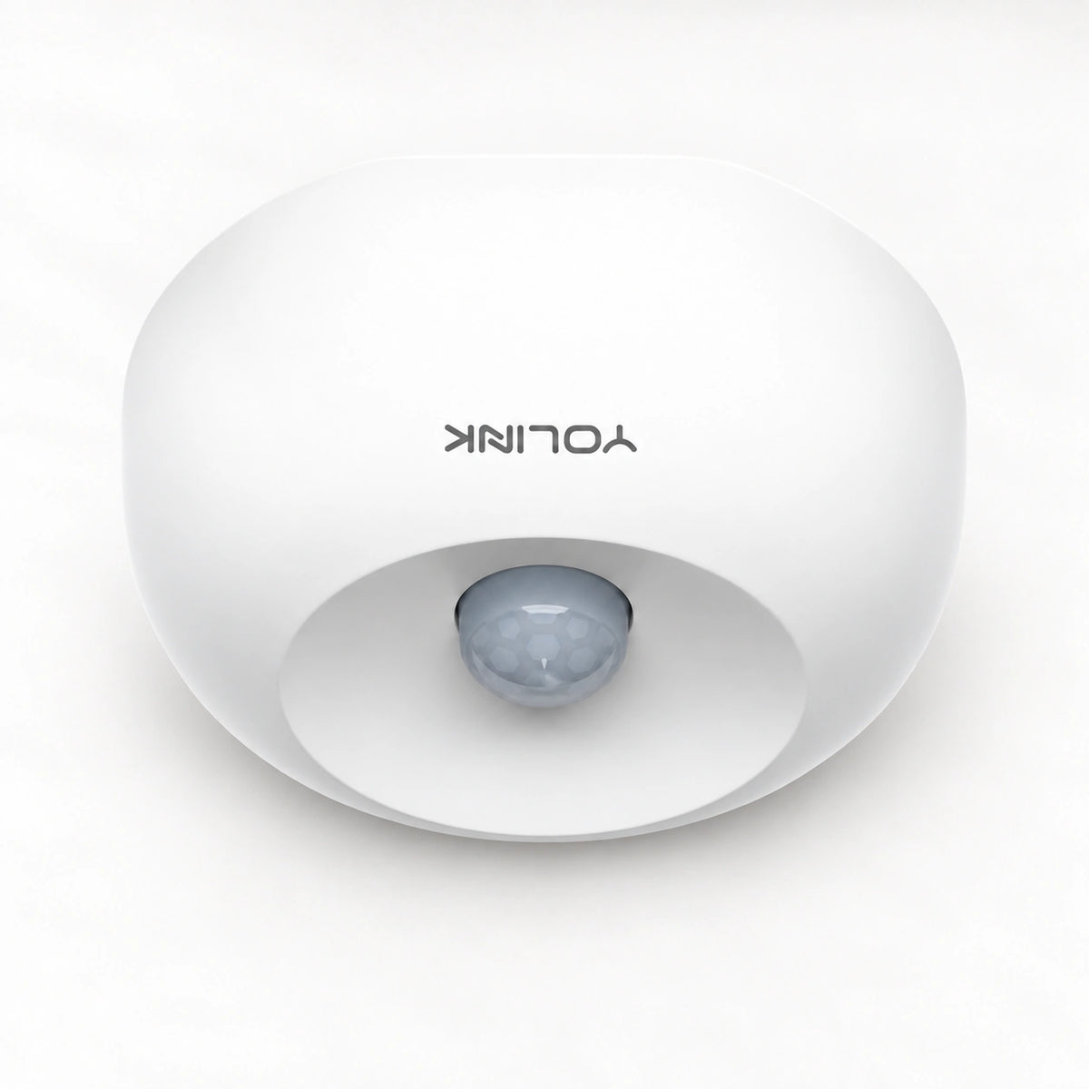 YoLink Indoor Motion Sensor — product-only photograph on smooth neutral off-white with soft diffused daylight shadows